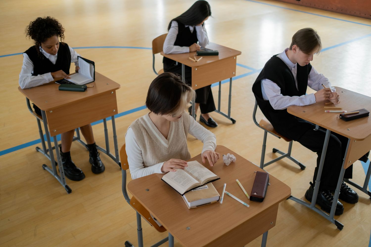Students studying together at classroom tables
